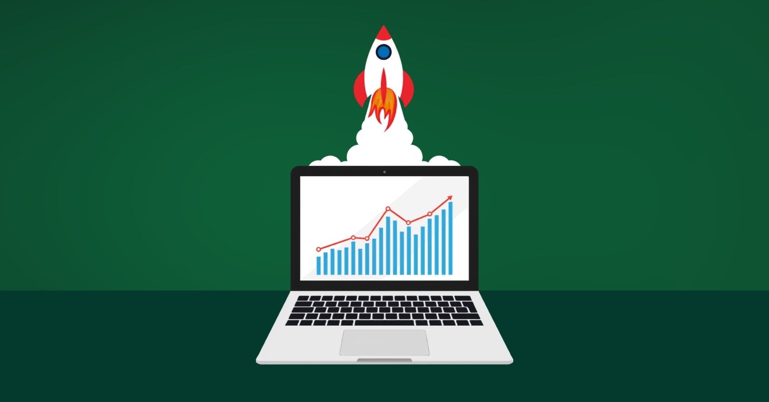 Illustration Of A Laptop Showing An Upward Trending Financial Chart, With A Rocket Launching Upward From The Screen.